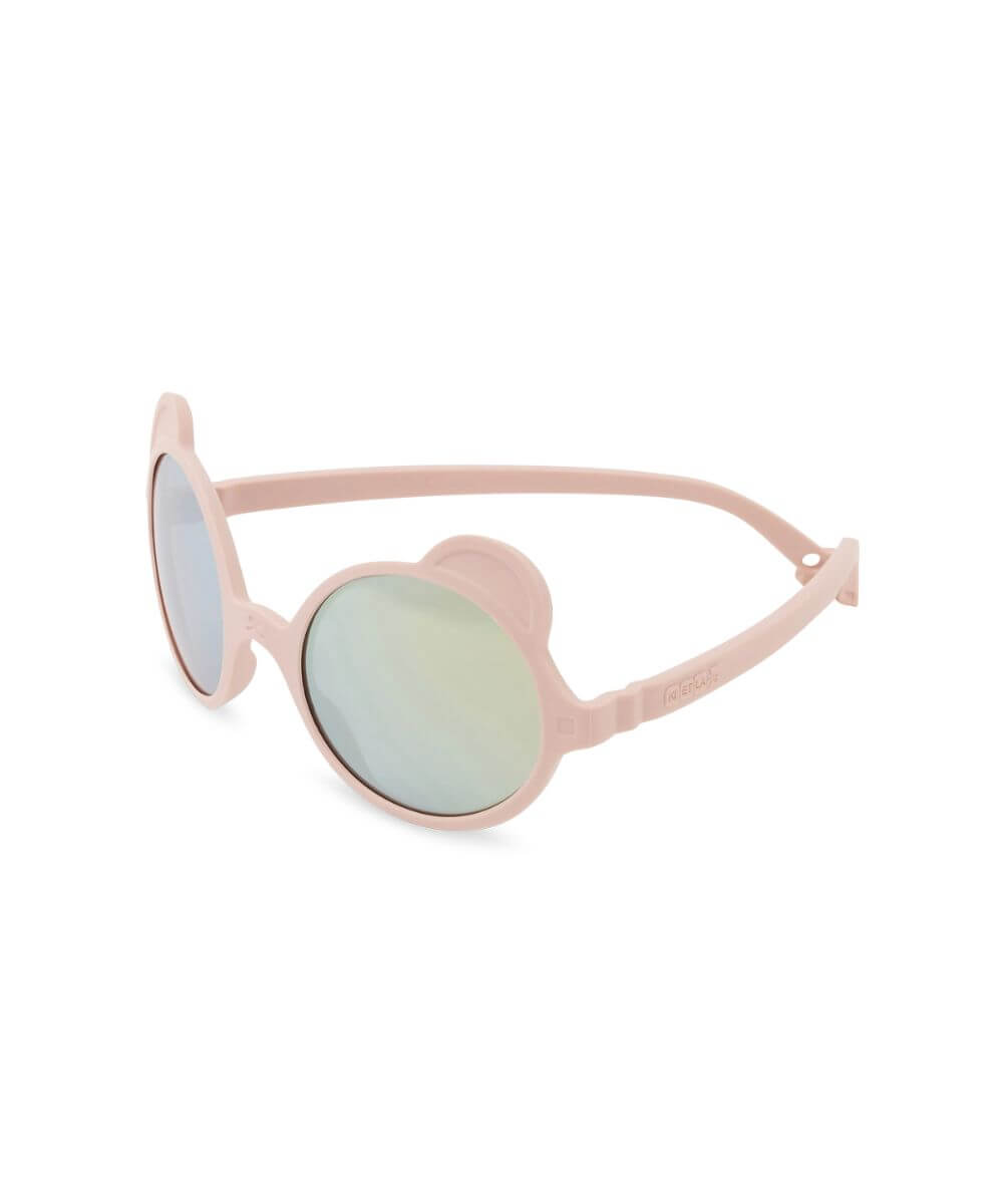 Lunettes Ourson Couleur Rose Pêche de la marque KI ET LA, sur fond blanc, vue de biais