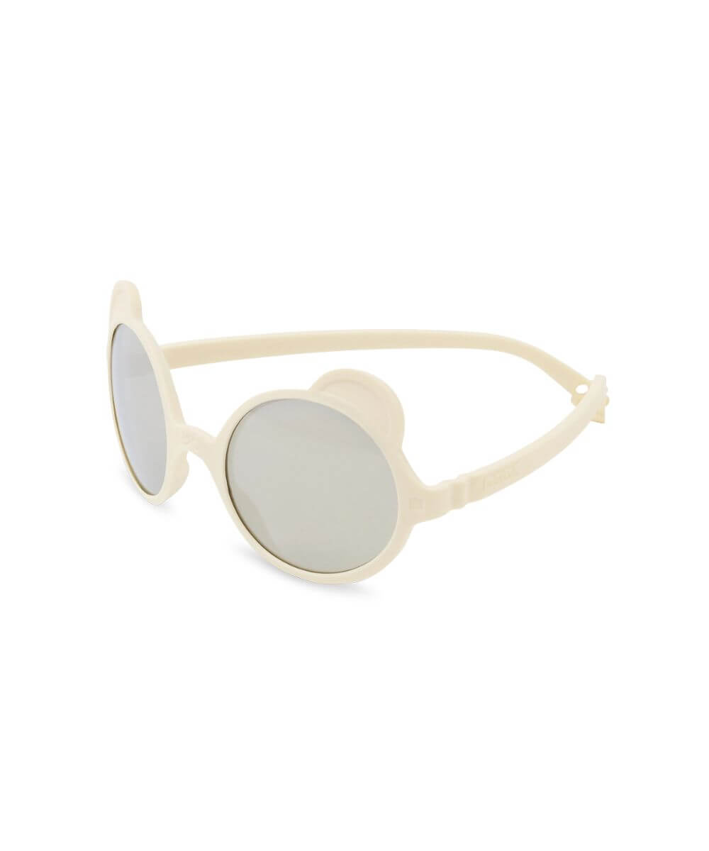 Lunettes Ourson Crème de la marque KI ET LA, sur fond blanc, vue de biais