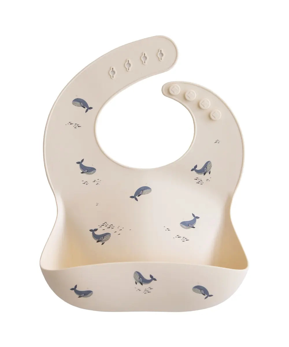 Bavoir en silicone motifs Baleines de la marque Mushie