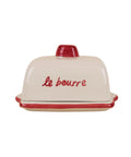 Beurrier en céramique rouge avec couvercle illustré de pâtisseries et inscription rétro Le Beurre de la marque Atelier Pistache