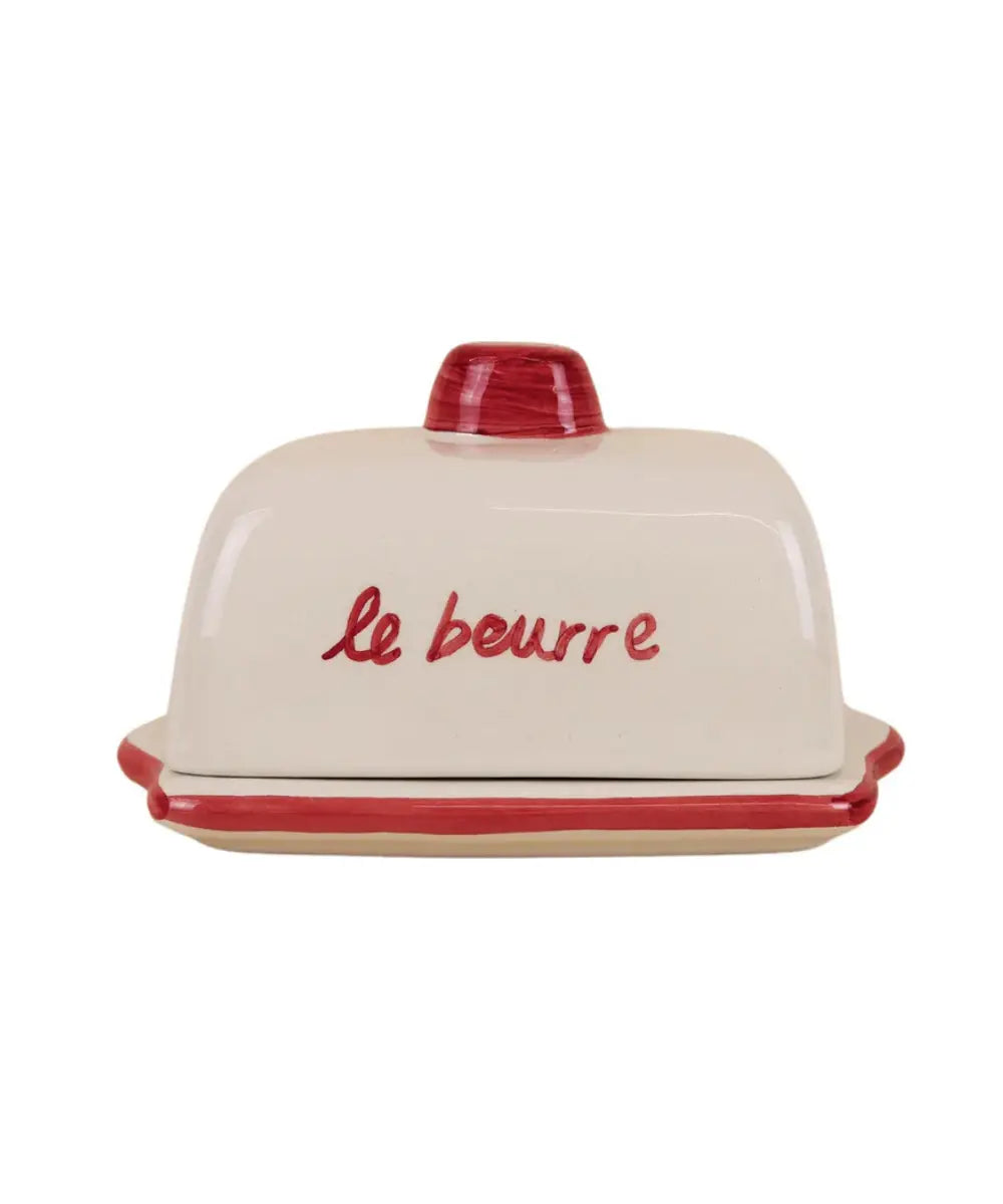 Beurrier en céramique rouge avec couvercle illustré de pâtisseries et inscription rétro Le Beurre de la marque Atelier Pistache
