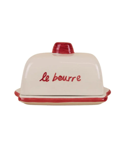 Beurrier en céramique rouge avec couvercle illustré de pâtisseries et inscription rétro Le Beurre de la marque Atelier Pistache