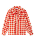 Photo sur fond blanc de la blouse Col Lavallière en vichy rouge de la marque Emile et Ida