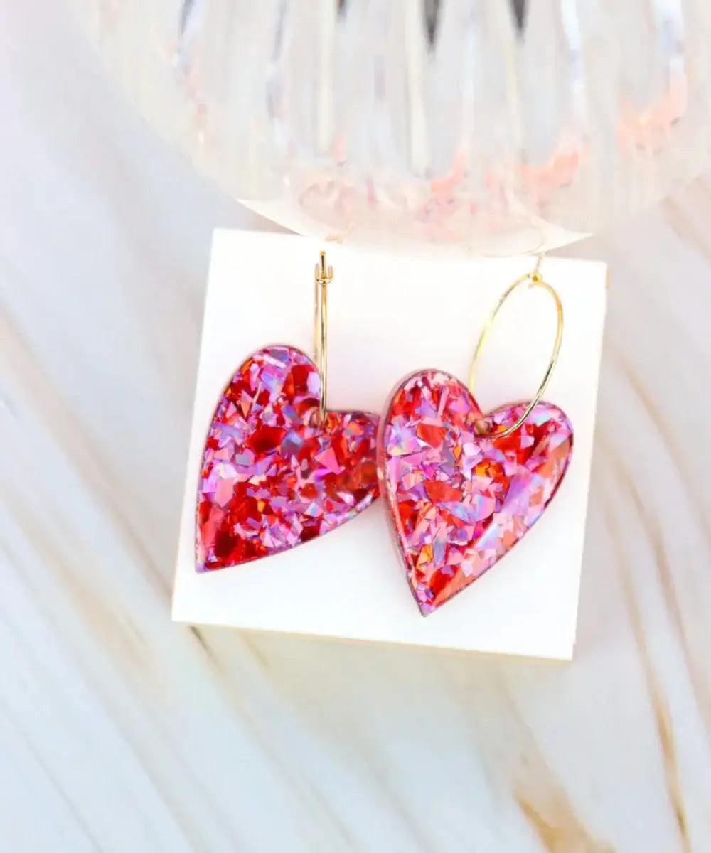 Boucles d'oreilles Mimi Flocons rouges roses sur support clair