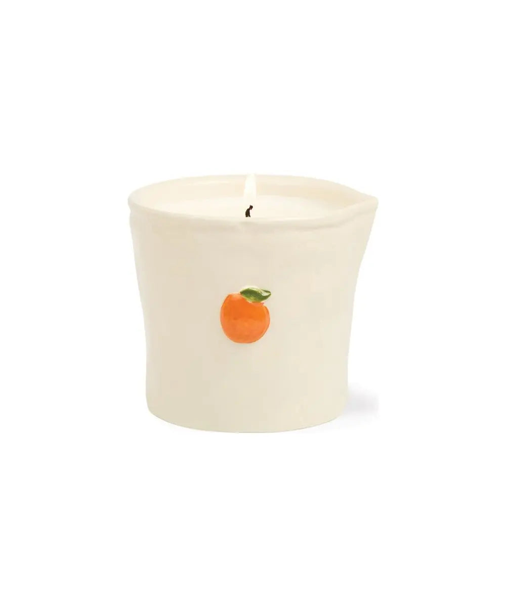 Bougie en céramique Citrus Spritz Bistro de Paddywax sur un fond blanc et allumée