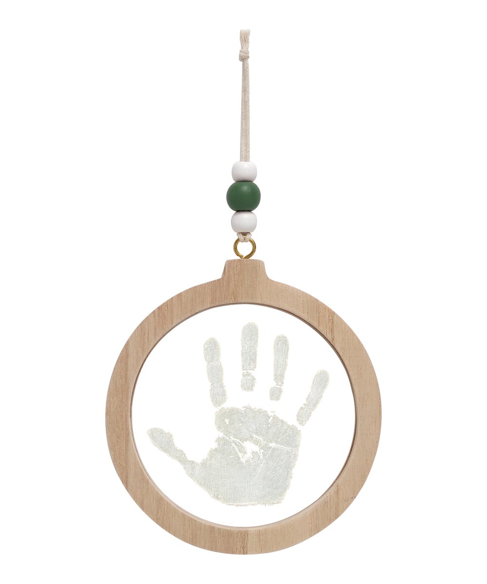 Vue produit de Boule de Noël empreinte transparente de la marque Petit Artichaut, sur fond blanc