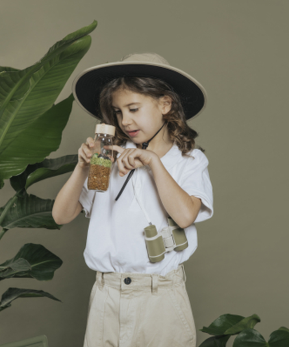 Bouteille sensorielle Spy Jurassic avec dinosaures cachés de Petit Boum