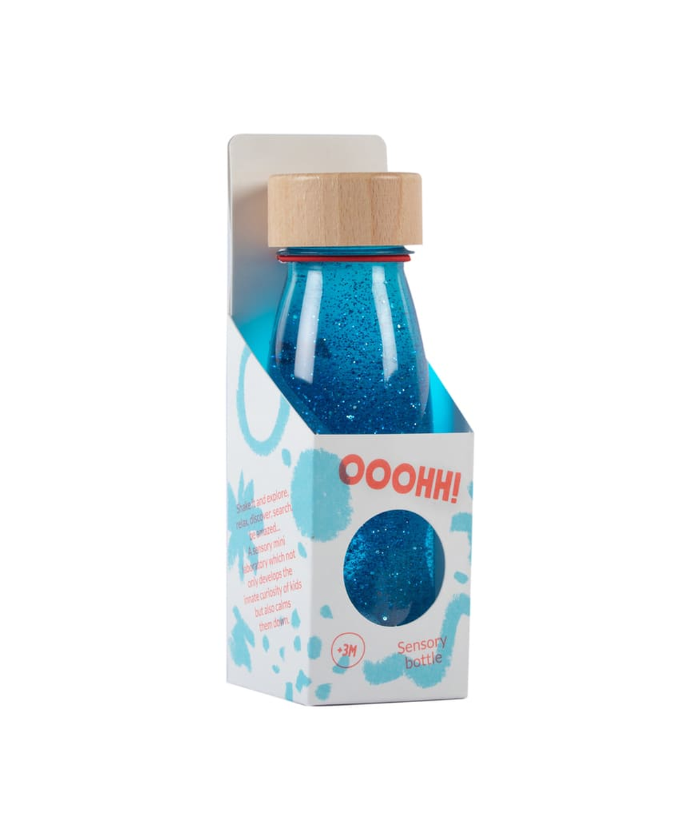 Bouteille sensorielle Float bleue avec paillettes et pompons de Petit Boum