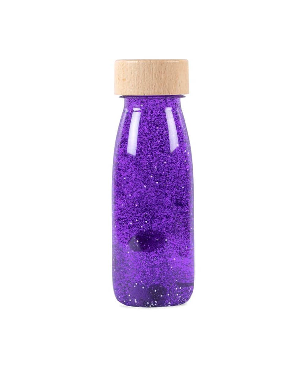 Bouteille sensorielle Float violette avec éléments flottants de Petit Boum