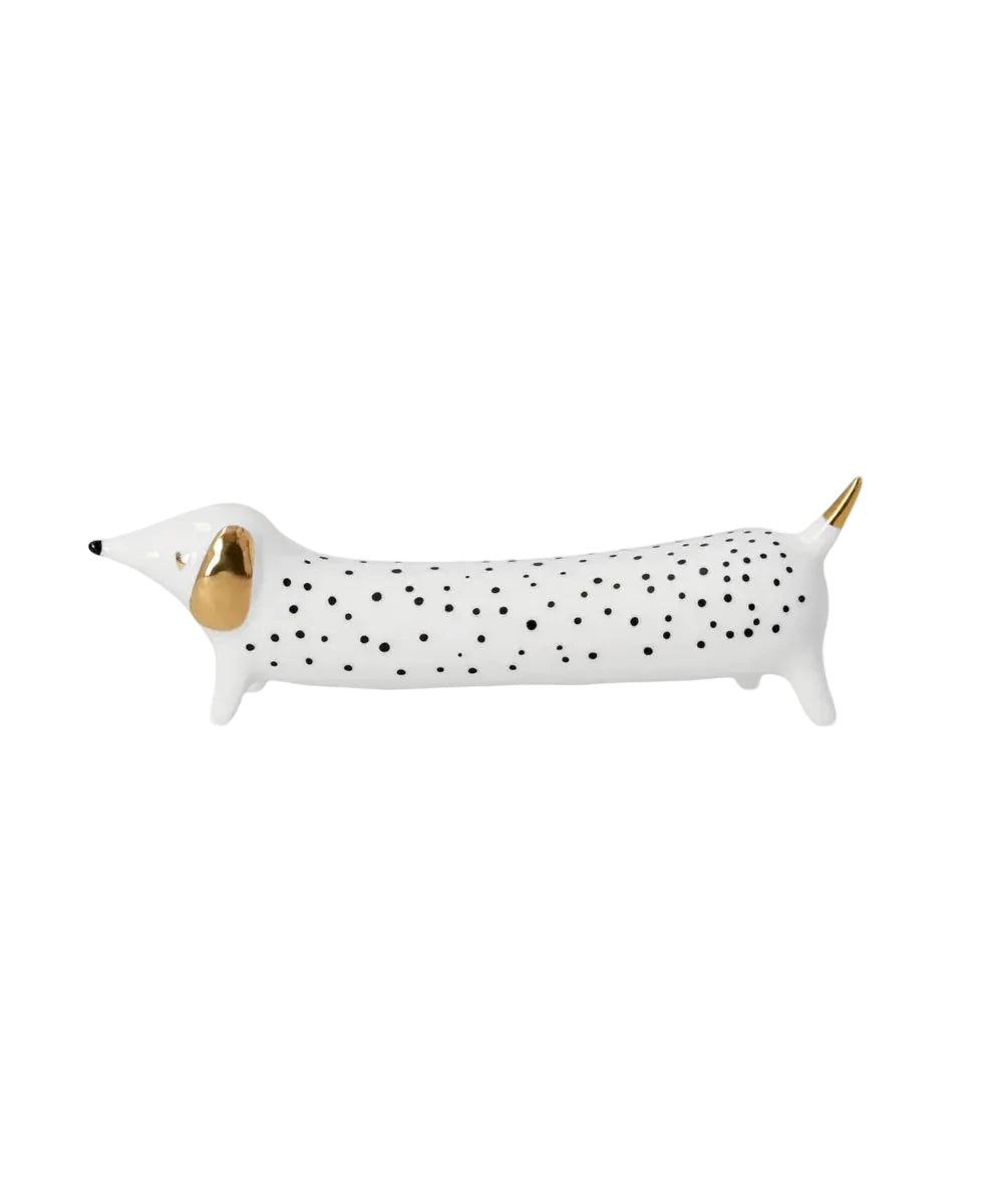 Figurine teckel Petits pois de la marque Räder, sur fond blanc
