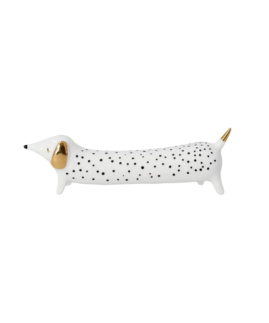 Figurine teckel Petits pois de la marque Räder, sur fond blanc