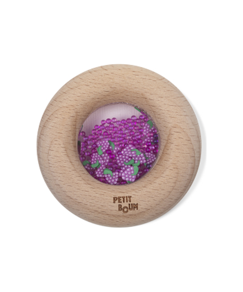 Hochet sensoriel Donut Raisins en bois naturel de la marque Petit Boum, sur fond blanc