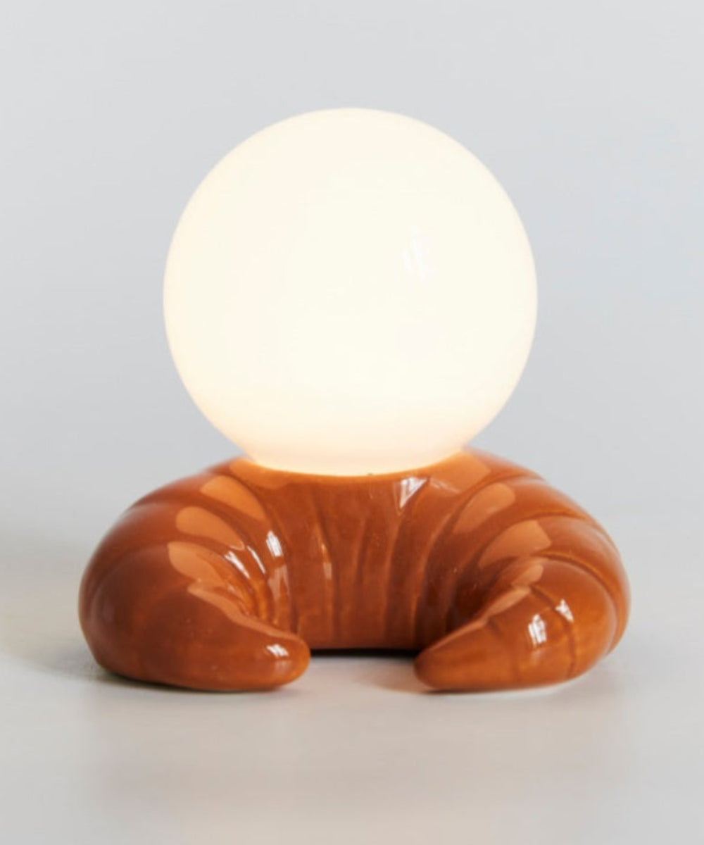 Lampe croissant vue de côté avec son globe rond