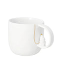 Mug en porcelaine blanche rader avec petite figurine de pere noel dans anse et details dores.