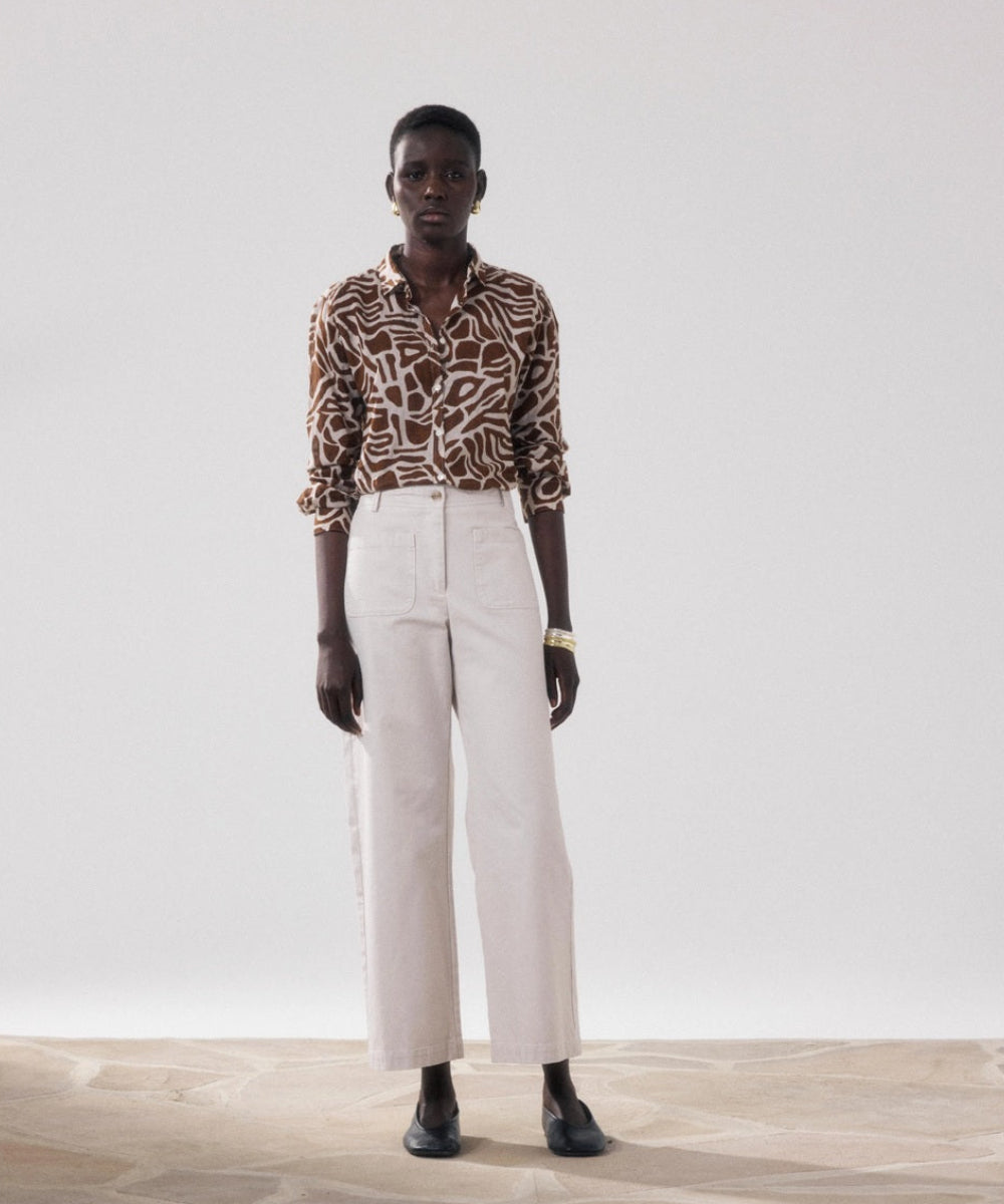 Pantalon Poli beige en coton porté
