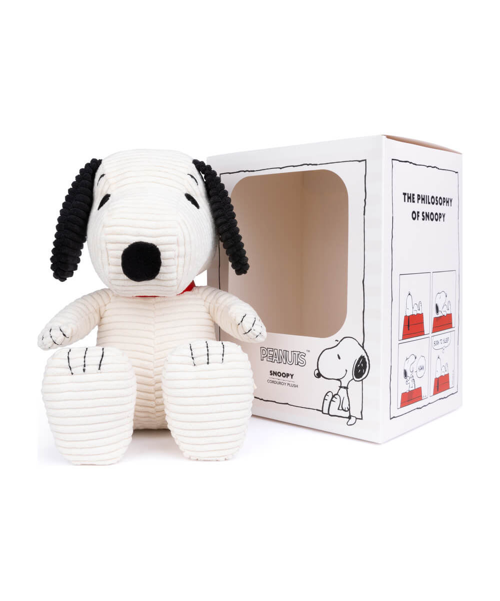 Peluche Snoopy velours côtelé Crème 27 cm de Bon Ton Toys, à côté de son coffret cadeau