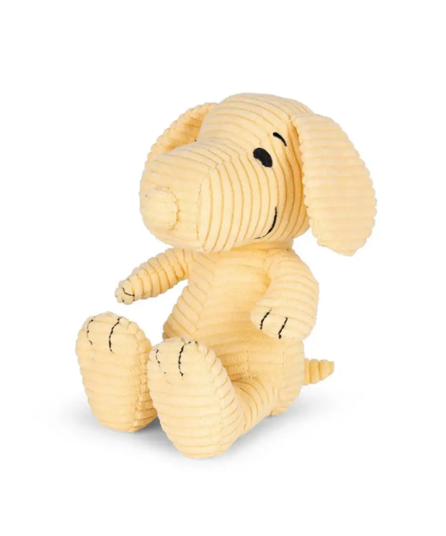 Peluche en velours côtelé jaune pastel sur fond blanc