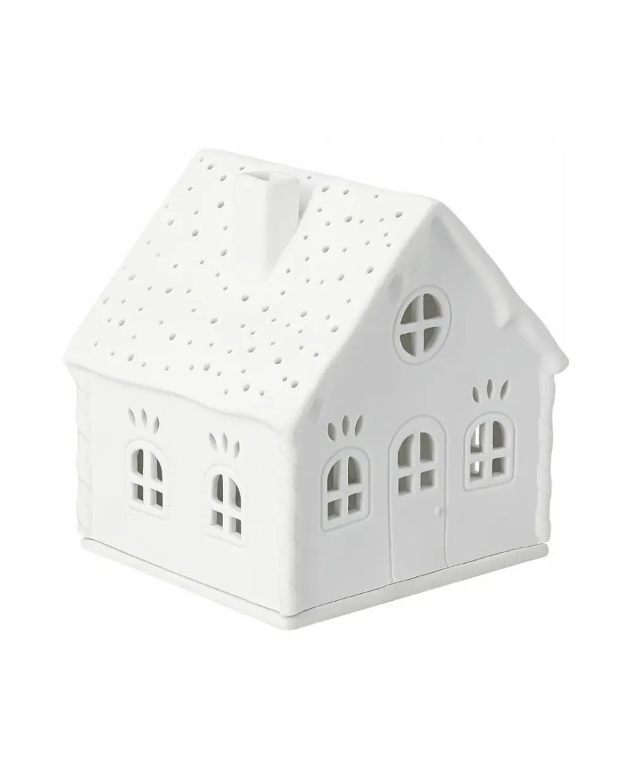 Maison photophore en porcelaine blanche sucre d orge rader avec fenetres ajourees.