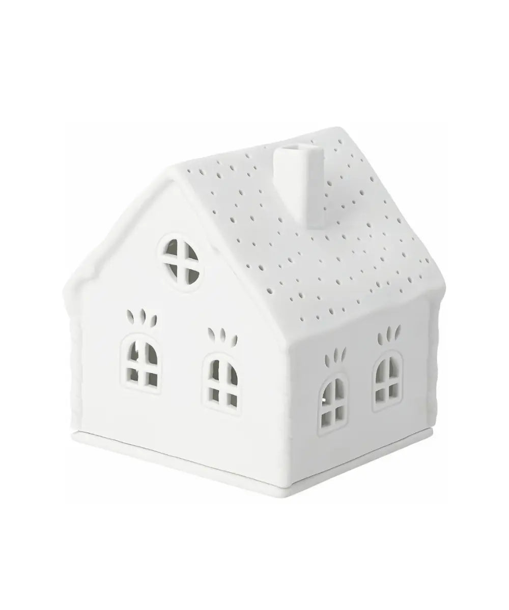 Maison photophore en porcelaine blanche sucre d orge rader avec fenetres ajourees.