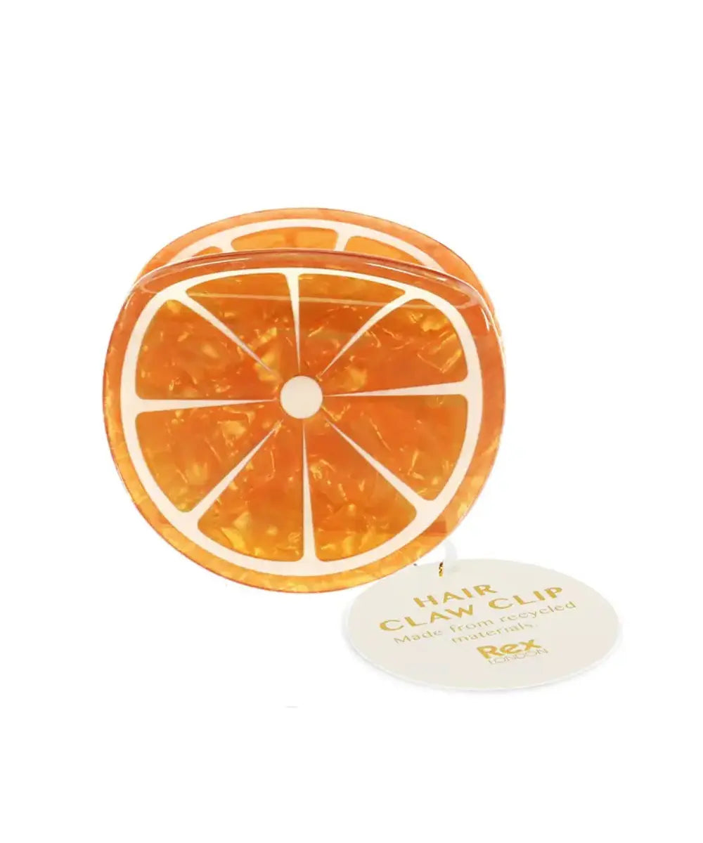 Pince à cheveux Orange sur fond blanc