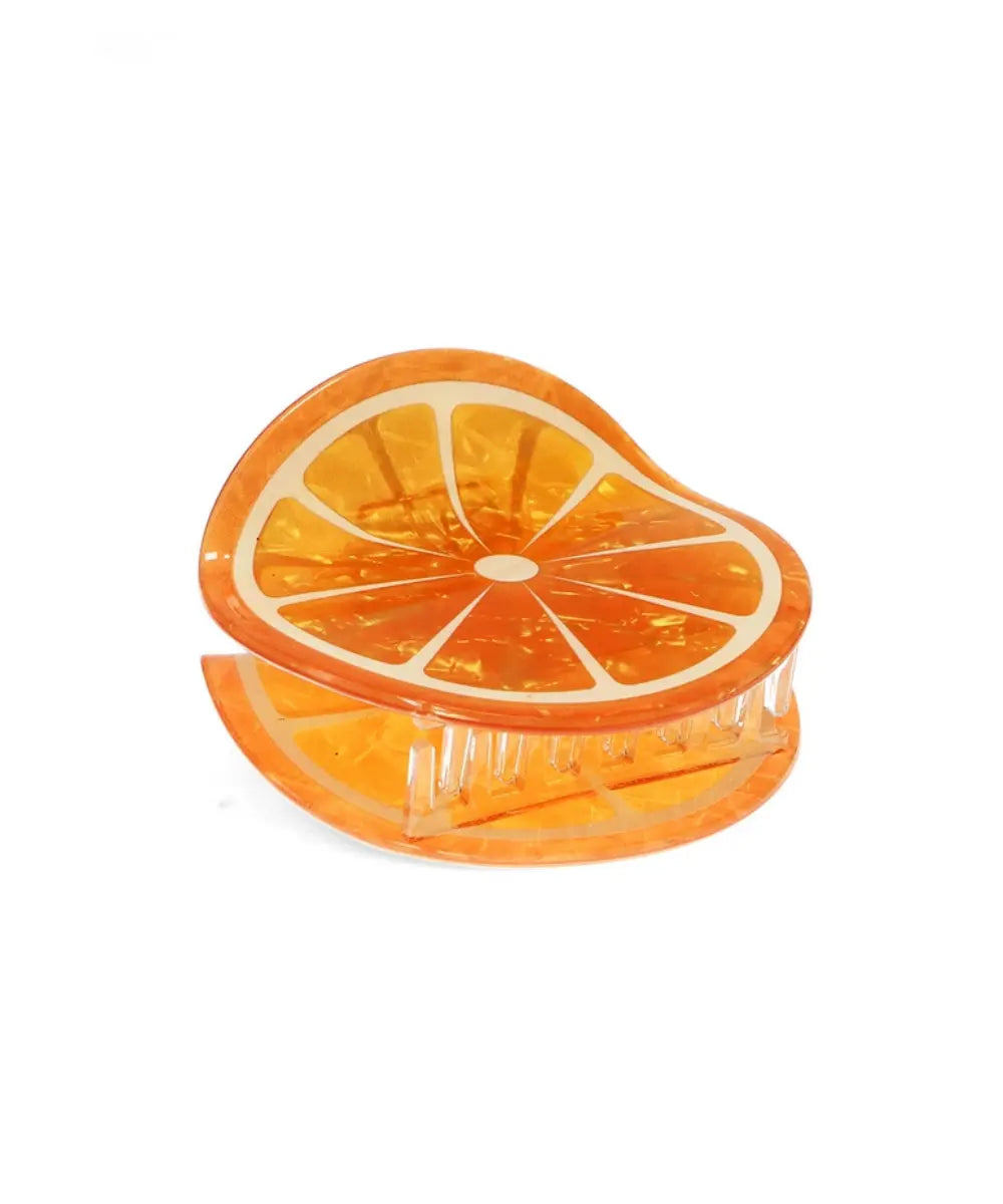 Pince à cheveux Orange sur fond blanc