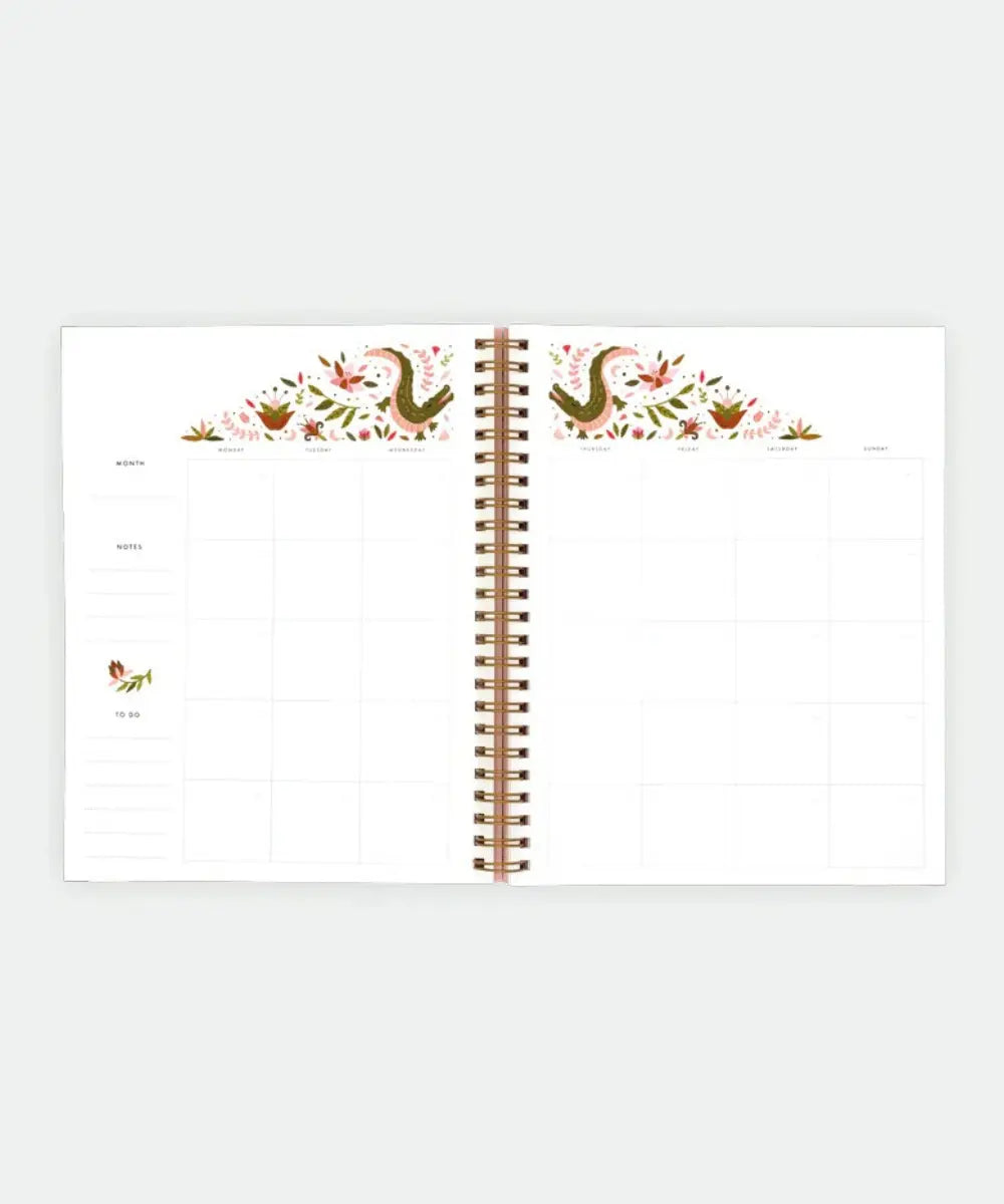 Carnet de planification mensuelle rose pastel motif crocodile avec spirales dorées de la marque All The Ways To Say.