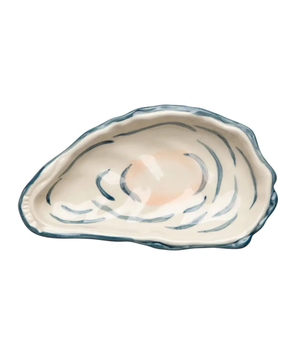 Petit plat en forme d'huître et réalisé en grès.