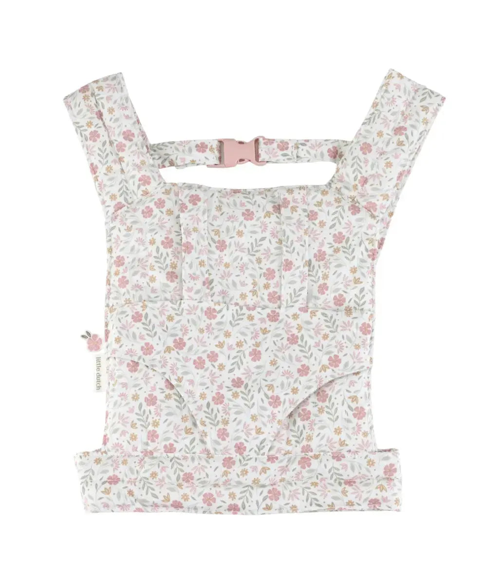 Porte-bébé jouet pour poupée Little Dutch avec imprimé floral rose et bretelles rembourrées.